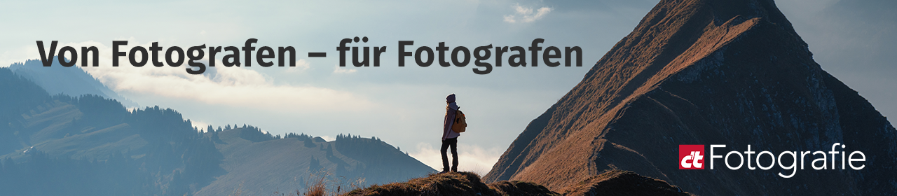 Header für c't Fotografie. Ein schönes Landschaftsmotiv mit Bergen und einer Person.